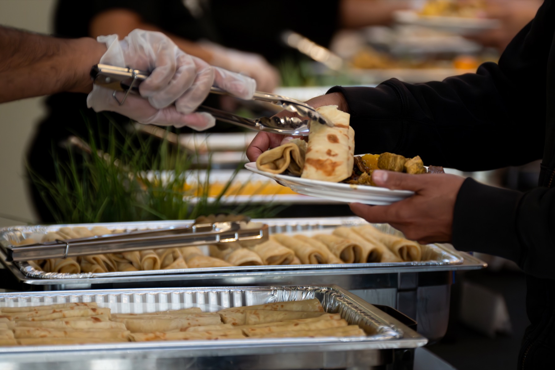 Roti being served from a catering tray